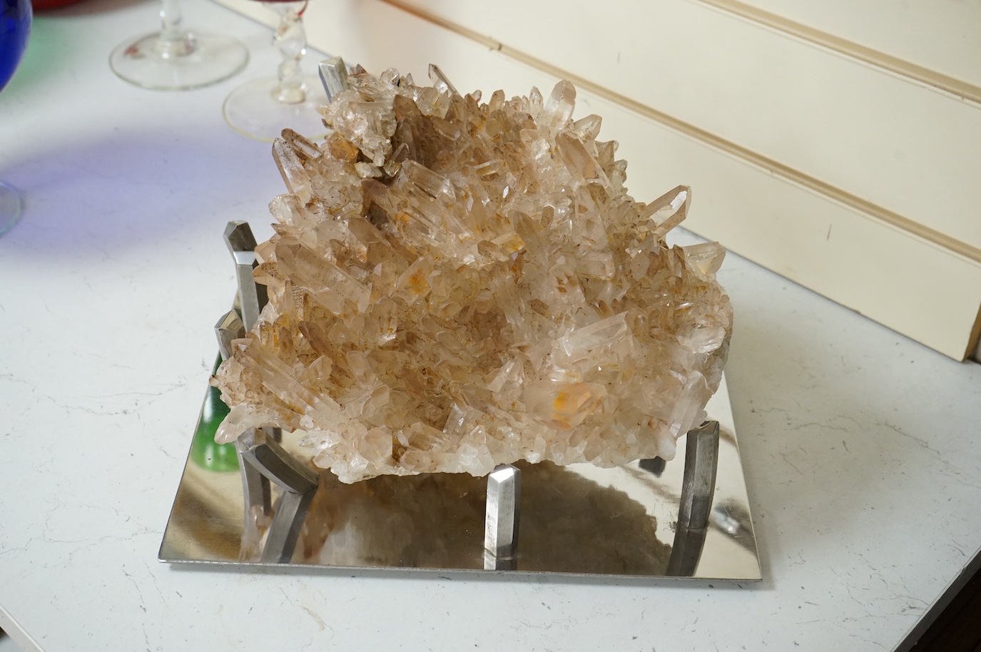 A large quartz specimen on bespoke chrome stand, stand 32cm wide x 26cm deep. Quartz 28cm wide x 27cm deep
